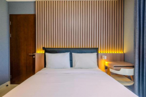 Fabulous 1BR Apartment at The Newton Ciputra World 2 By Travelio